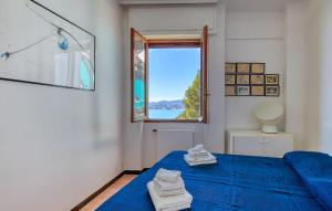 Ένα ή περισσότερα κρεβάτια σε δωμάτιο στο Cozy Apartment In Chiavari With Kitchen