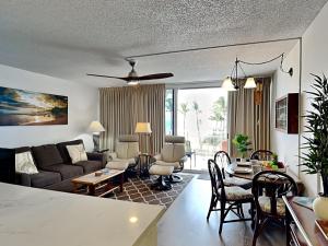 a living room with a couch and a table at Island Surf 506 in Kihei