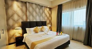 Postel nebo postele na pokoji v ubytování Loumage S Suites and Spa