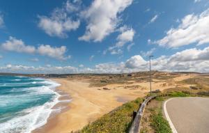 a beach with a street light next to the ocean at 1 Bedroom Beautiful Home In Arbus in Arbus