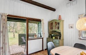 a dining room with a table and a window at Awesome Home In Vordingborg With Wifi in Vordingborg