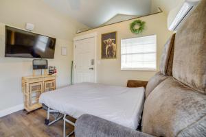 a bedroom with a bed and a flat screen tv at Pocatello Vacation Rental with Mountain Views! in Pocatello
