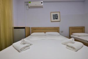 Postel nebo postele na pokoji v ubytování Hotel Billy