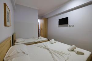 Postel nebo postele na pokoji v ubytování Hotel Billy