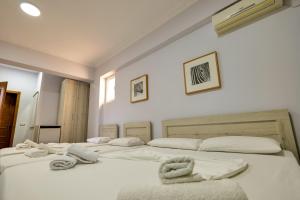 Postel nebo postele na pokoji v ubytování Hotel Billy