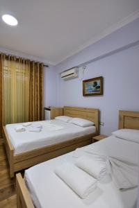 Postel nebo postele na pokoji v ubytování Hotel Billy