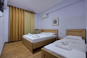 Postel nebo postele na pokoji v ubytování Hotel Billy