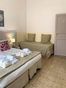 Voodi või voodid majutusasutuse Biancorèroma B&B toas
