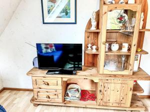 a wooden desk with a laptop on top of it at Apartment Gebauer-1 by Interhome in Fuchshofen