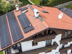 a house with solar panels on the roof at Apartment Neurauter-1 by Interhome in Fügen