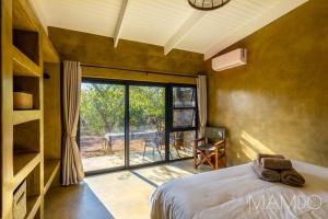Postel nebo postele na pokoji v ubytování Mamdo Bush House