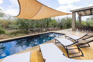 Bazén v ubytování Mamdo Bush House nebo v jeho okolí