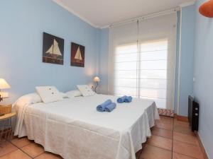 Ein Bett oder Betten in einem Zimmer der Unterkunft Apartment Port Pals A I by Interhome