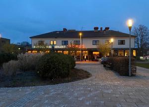 a building with a street light in front of it at Hotell Iföhus in Bromölla