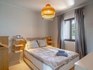 Postel nebo postele na pokoji v ubytování Holiday Home Melon by Interhome