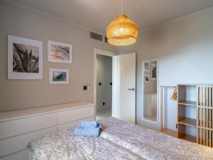 Postel nebo postele na pokoji v ubytování Holiday Home Melon by Interhome
