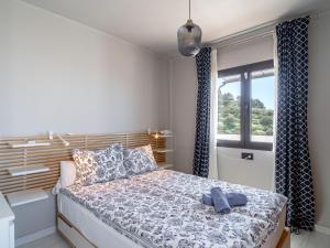 Postel nebo postele na pokoji v ubytování Holiday Home Melon by Interhome