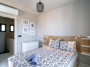 Postel nebo postele na pokoji v ubytování Holiday Home Melon by Interhome
