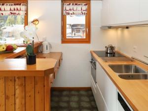 Kuchyň nebo kuchyňský kout v ubytování Apartment Le Sporting 213 by Interhome + 19 fotografií