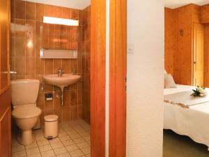 Kopalnica v nastanitvi Apartment Le Sporting 213 by Interhome