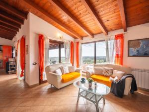 a living room with a couch and a table at Apartment Sea view by Interhome in Villaputzu