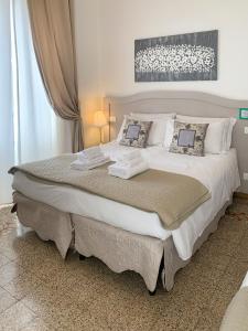 Postel nebo postele na pokoji v ubytování Biancorèroma B&B