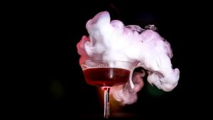 a glass of wine is covered in white smoke at TORTUE Hamburg in Hamburg