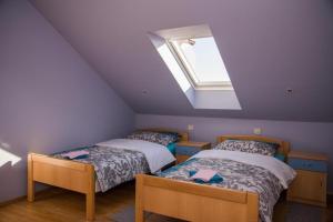 Posteľ alebo postele v izbe v ubytovaní ROOMS free - Zagorje