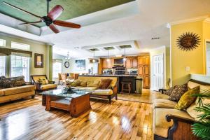 a living room with couches and a ceiling fan at Siesta Key Beach Home in Siesta Key