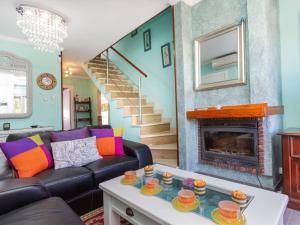 a living room with a couch and a fireplace at Holiday Home Villa Angeles by Interhome in L'Ametlla de Mar +20 photos
