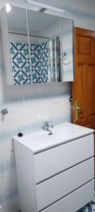 a bathroom with a white sink and a mirror at Xenia Alojamientos in Santiago de la Espada +68 photos