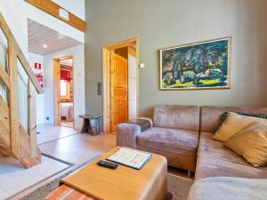 a living room with a couch and a table at Holiday Home Nilikuru g18 by Interhome in Saariselka