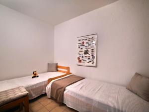 Giường trong phòng chung tại Apartment l'Oasis by Interhome