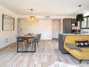 a dining room and kitchen with a table and chairs at Holiday Home Hotel du Nord by Interhome in Mimizan +30 photos