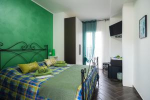 Posteľ alebo postele v izbe v ubytovaní la casa dei limoni