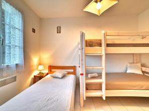 Postel nebo postele na pokoji v ubytování Holiday Home Domino by Interhome