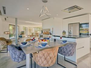 a kitchen with a table and some chairs at Villa Villa Eos by Interhome in Jávea +67 photos