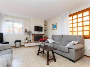 a living room with a couch and a table at Holiday Home Escorpio-1 by Interhome in Tossa de Mar