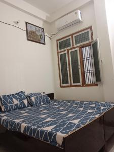 Postel nebo postele na pokoji v ubytování Ramrameti Homestay