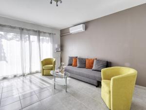 a living room with a couch and two chairs at Holiday Home bonnegrace by Interhome in Six-Fours-les-Plages