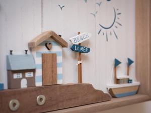 a toy house sitting on top of a shelf at Apartment Harbour Nights 7C by Interhome in Lossiemouth