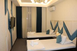 Katil atau katil-katil dalam bilik di Hotel Tajikgrey Dushanbe