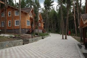 a cobblestone street in front of a house at Ski Paradise Karakol in Karakol