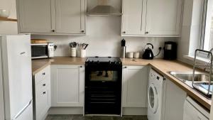 Køkken eller tekøkken på Stockwood Holiday Bungalow