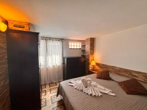 a bedroom with a bed with a towel on it at Apartment Domu Franziska - Beach & City Holiday in Cagliari