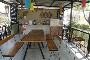 a group of tables and chairs on a patio at Maewang Resort in Lampang