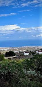 a view of a city from a hill with the sky at Casa Rozita in Granadilla de Abona