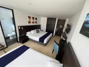 Postel nebo postele na pokoji v ubytování Hotel H53