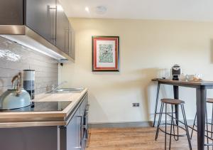 a kitchen with a sink and a counter top at The Apple Tree - Pershore in Pershore