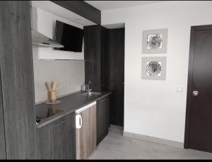 a kitchen with a sink and a counter top at Estudio Central in Estepona